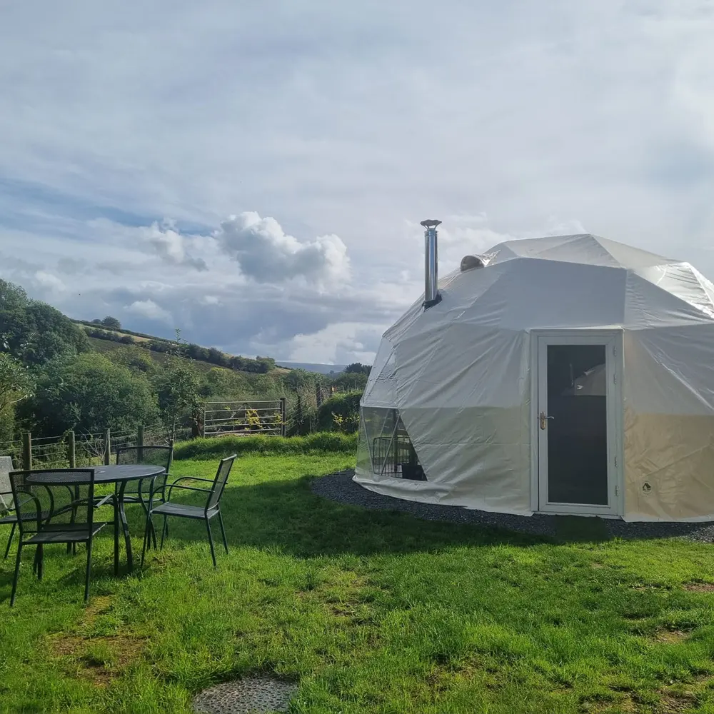 outside Eira Dome with log burner